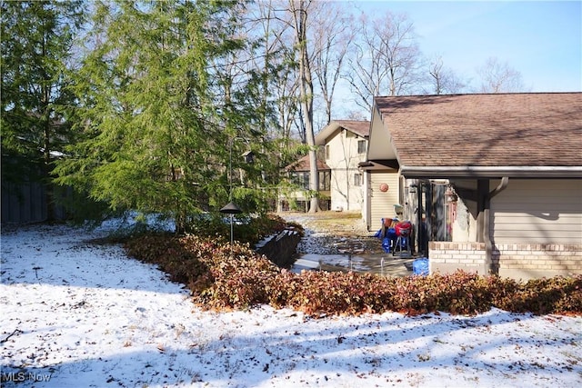 view of yard covered in snow