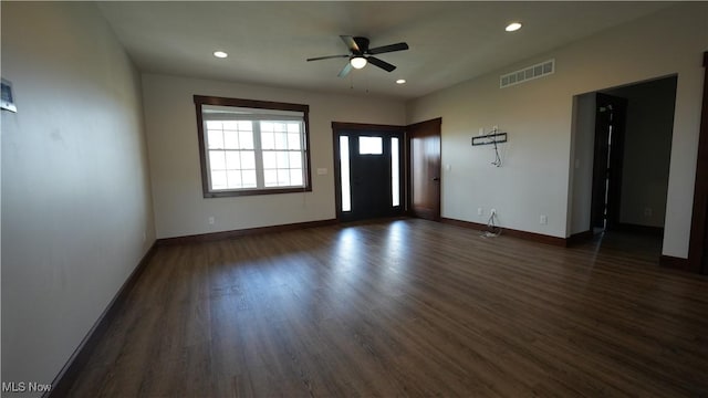 empty room with ceiling fan and dark hardwood / wood-style floors