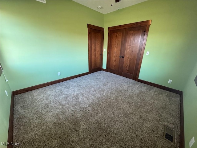 unfurnished bedroom with carpet floors