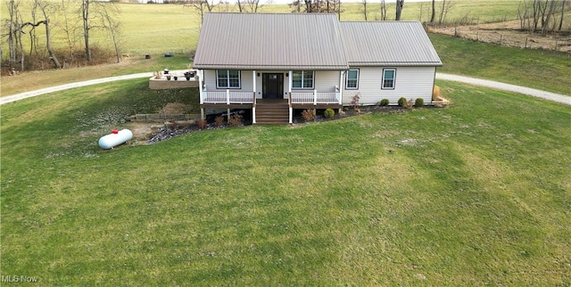 view of front of property with a front yard and covered porch