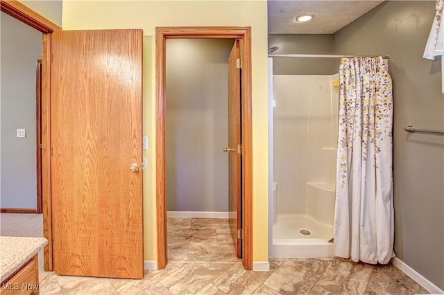 bathroom featuring vanity and walk in shower