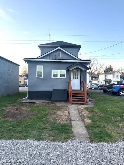 view of front of home with a front lawn