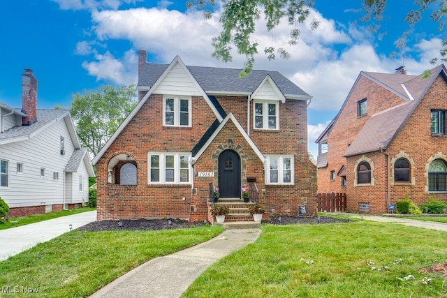 tudor house with a front lawn