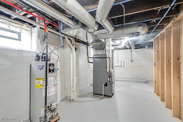 basement featuring heating unit and water heater