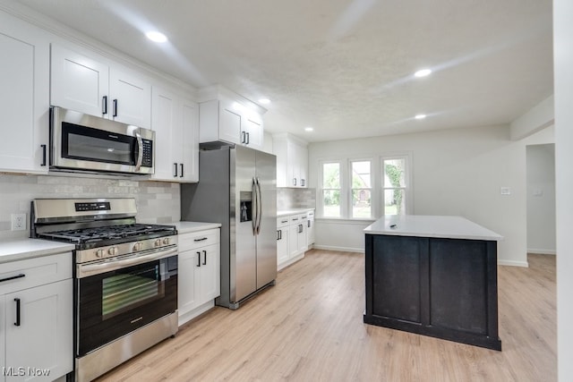 kitchen featuring white cabinetry, light hardwood / wood-style flooring, and stainless steel appliances