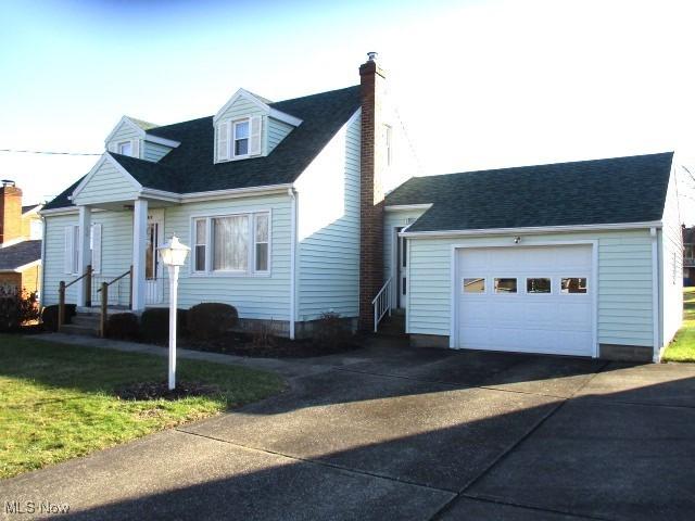 cape cod house with a garage