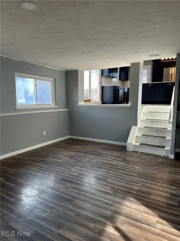 basement featuring dark hardwood / wood-style floors