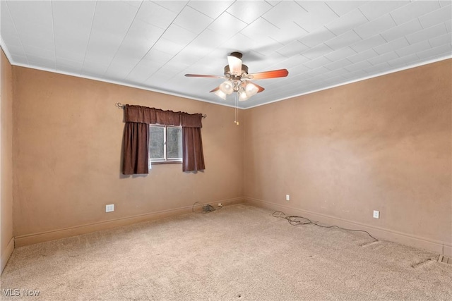 unfurnished room with carpet floors, ceiling fan, and crown molding