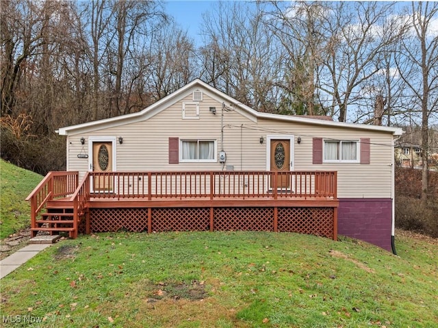 view of front of home with a front lawn and a wooden deck