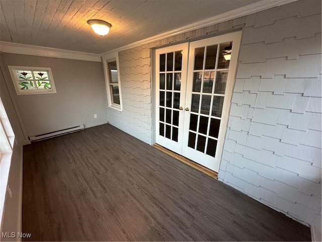 interior space featuring french doors, brick wall, crown molding, a baseboard heating unit, and dark hardwood / wood-style floors