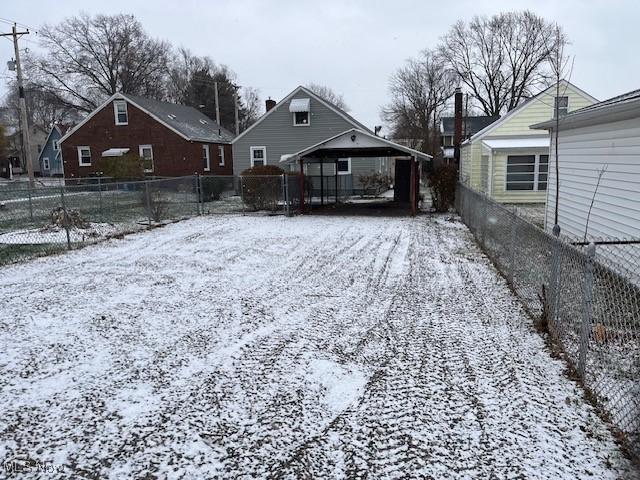 view of yard layered in snow