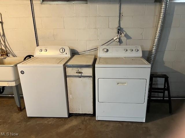 washroom with independent washer and dryer