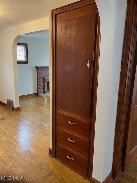 hall with light hardwood / wood-style flooring