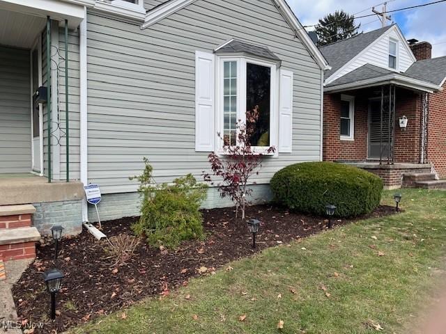 view of home's exterior featuring a yard