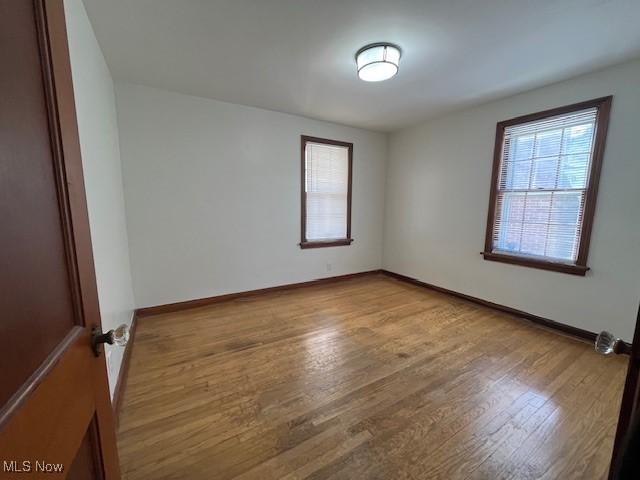 empty room with light wood-type flooring