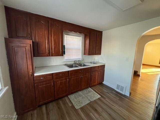 kitchen with dark hardwood / wood-style floors and sink