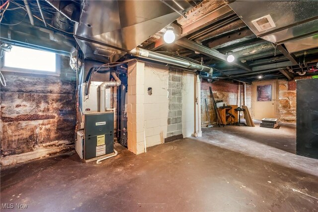 basement featuring heating unit