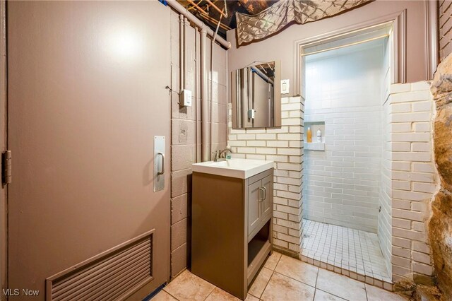 bathroom with tile patterned floors and vanity