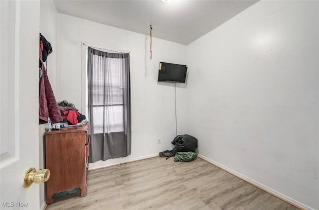 spare room with light hardwood / wood-style flooring