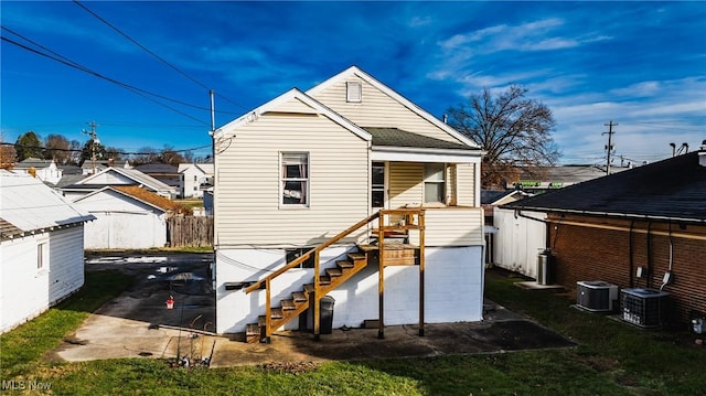 back of house with cooling unit