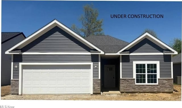 1372 Park Ave, Akron, OH 44312 - craftsman inspired home featuring stone siding, an attached garage, and driveway