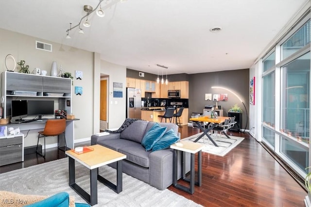 living room with dark hardwood / wood-style floors