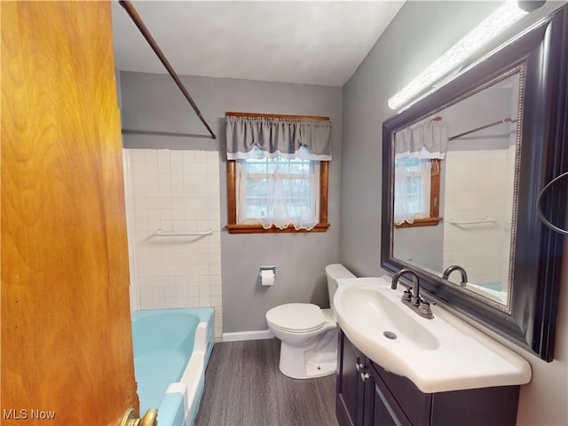 full bathroom featuring shower / tub combination, toilet, vanity, and hardwood / wood-style flooring