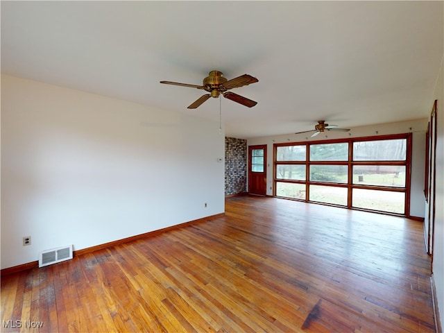 empty room featuring ceiling fan and wood-type flooring