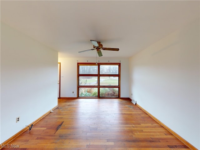 unfurnished room featuring ceiling fan and light hardwood / wood-style floors