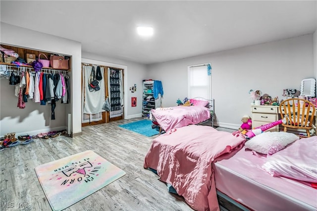 bedroom featuring a closet and hardwood / wood-style flooring