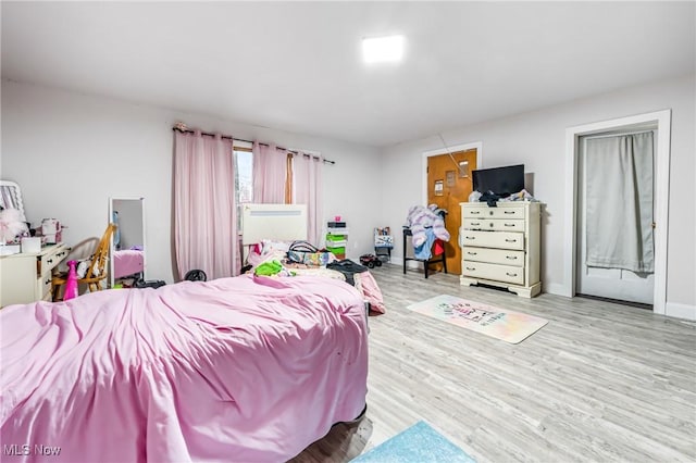 bedroom with light hardwood / wood-style flooring