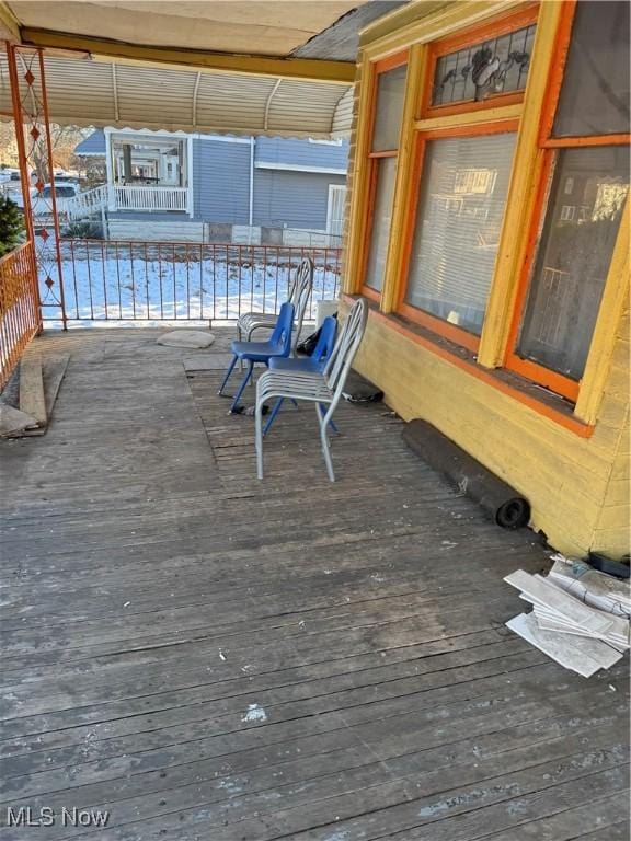 wooden terrace featuring covered porch