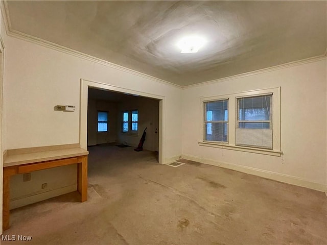 carpeted spare room with ornamental molding