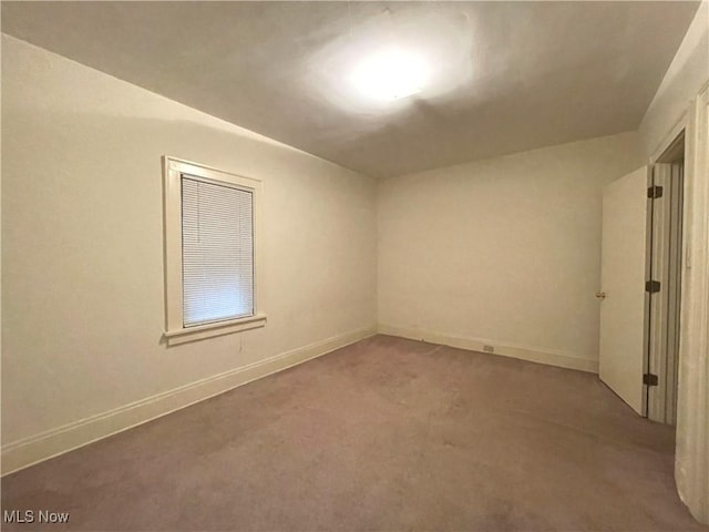 unfurnished room with carpet floors