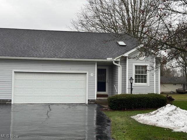 ranch-style home with a garage