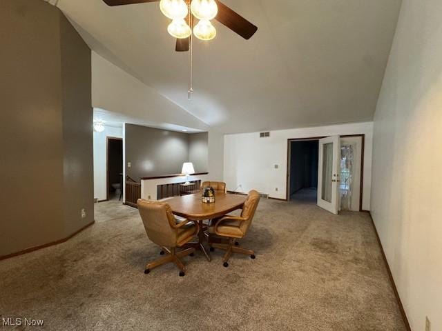 carpeted dining room featuring french doors, ceiling fan, and lofted ceiling