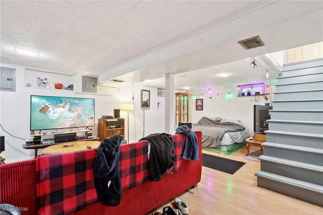 interior space with hardwood / wood-style floors and electric panel