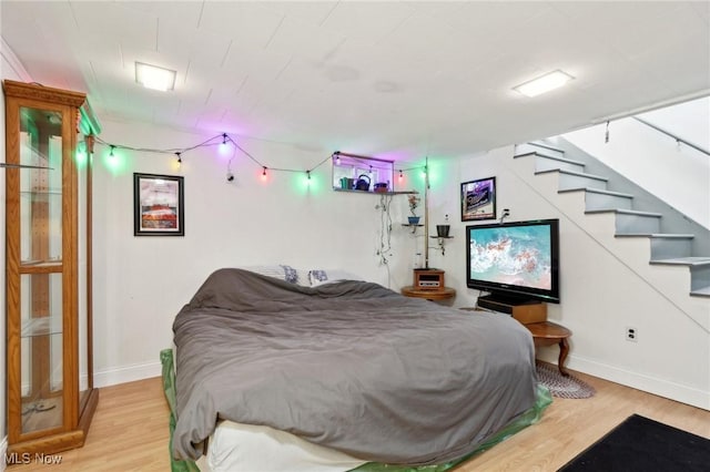 bedroom featuring wood-type flooring