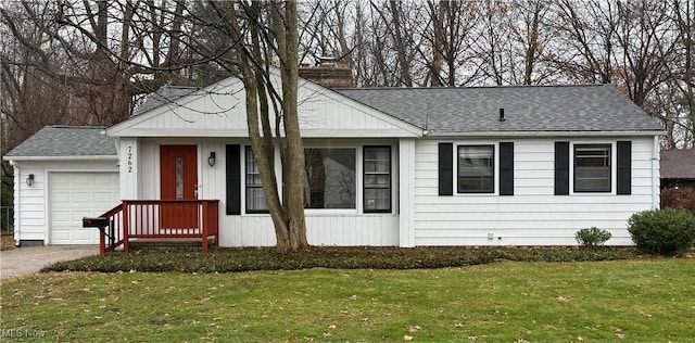 ranch-style home with a front lawn and a garage