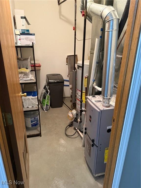 utility room featuring gas water heater