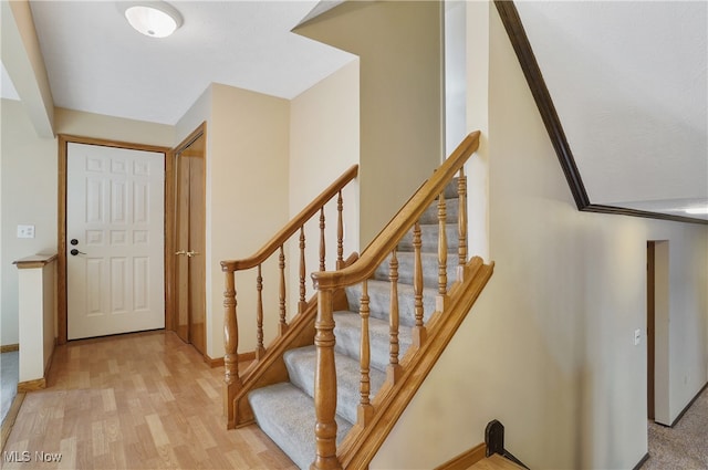 stairway featuring hardwood / wood-style floors