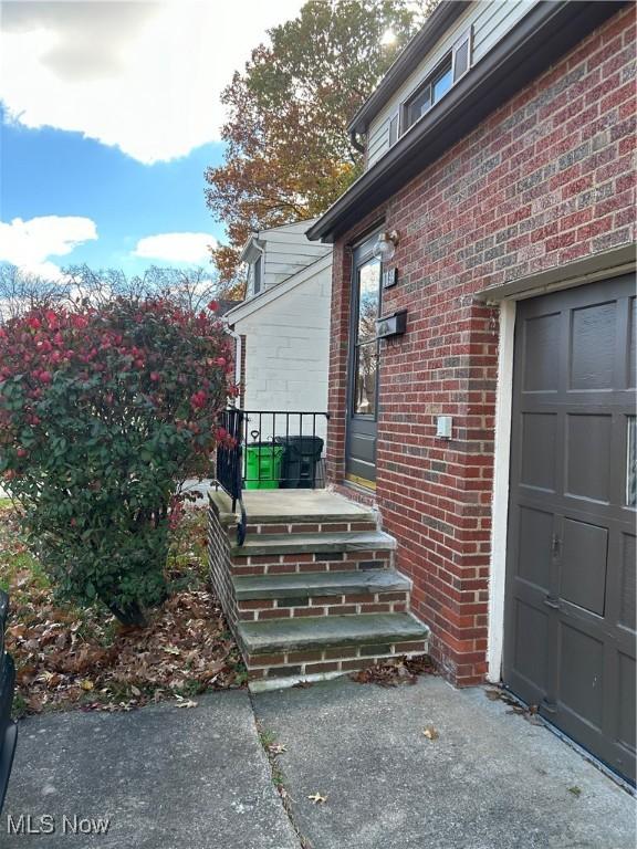 entrance to property featuring a garage