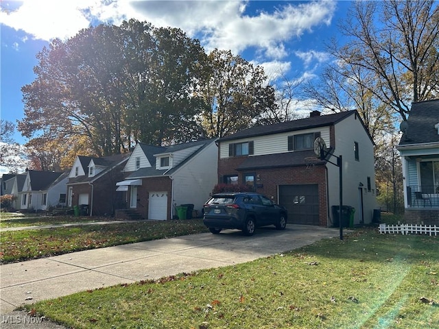 view of front of house with a front lawn and a garage