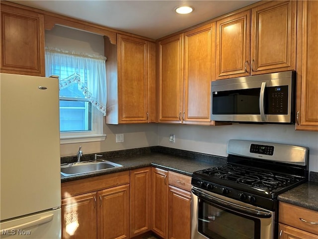 kitchen featuring appliances with stainless steel finishes and sink