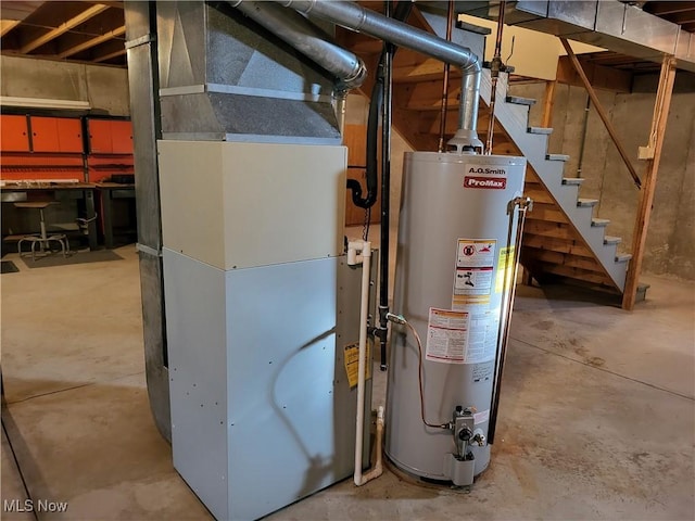 utility room with heating unit and water heater