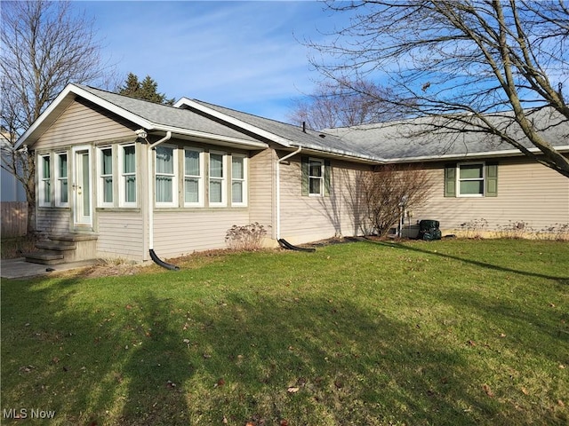 view of home's exterior with a yard