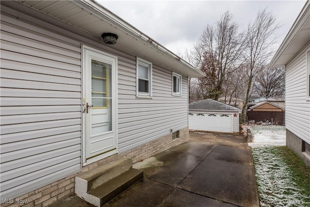 view of home's exterior with a garage and an outdoor structure