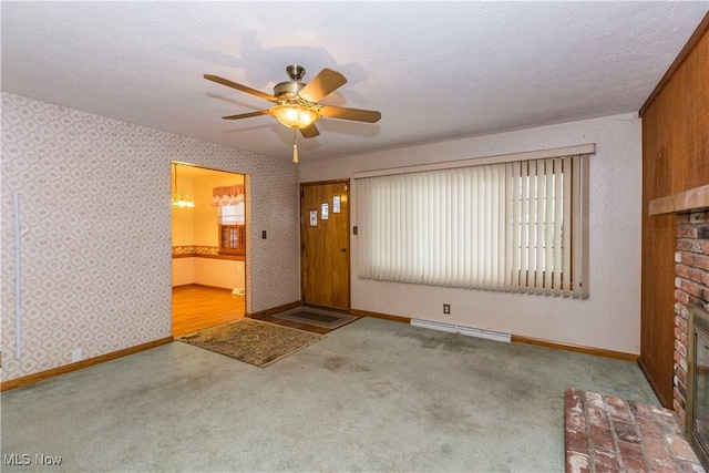 interior space featuring a textured ceiling, carpet flooring, a fireplace, and a baseboard radiator