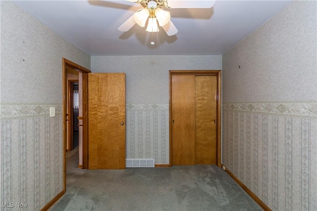 unfurnished bedroom with ceiling fan and light carpet