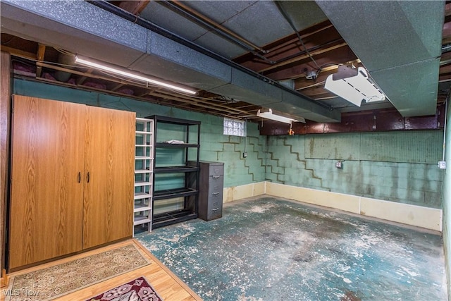 basement featuring hardwood / wood-style floors